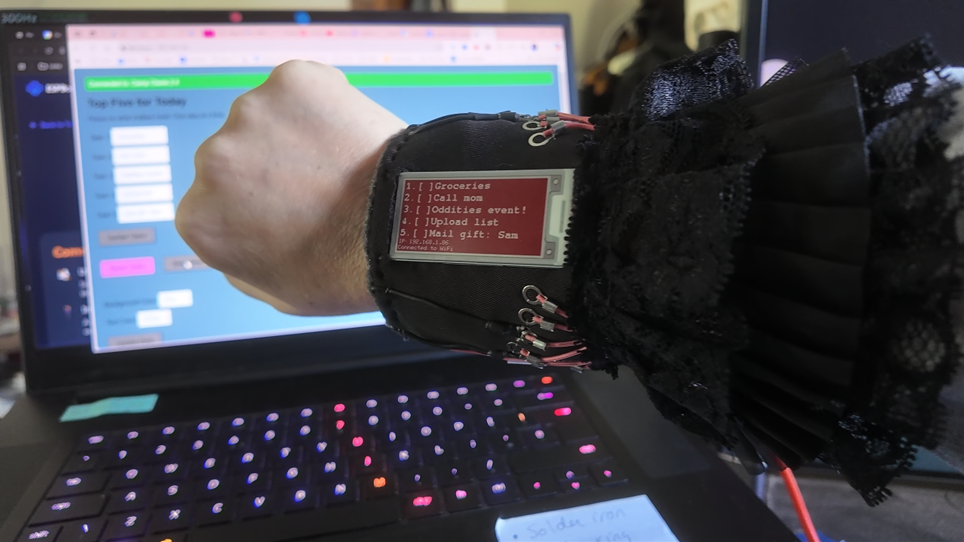 holding wrist up to computer screen
