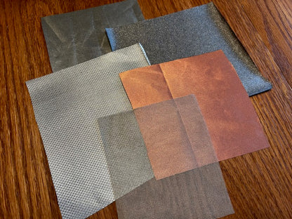 Five conductive fabrics overlapping: silver, copper and mesh