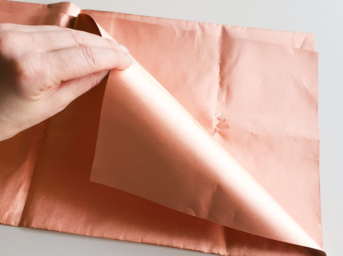 Copper conductive fabric with a folded corner