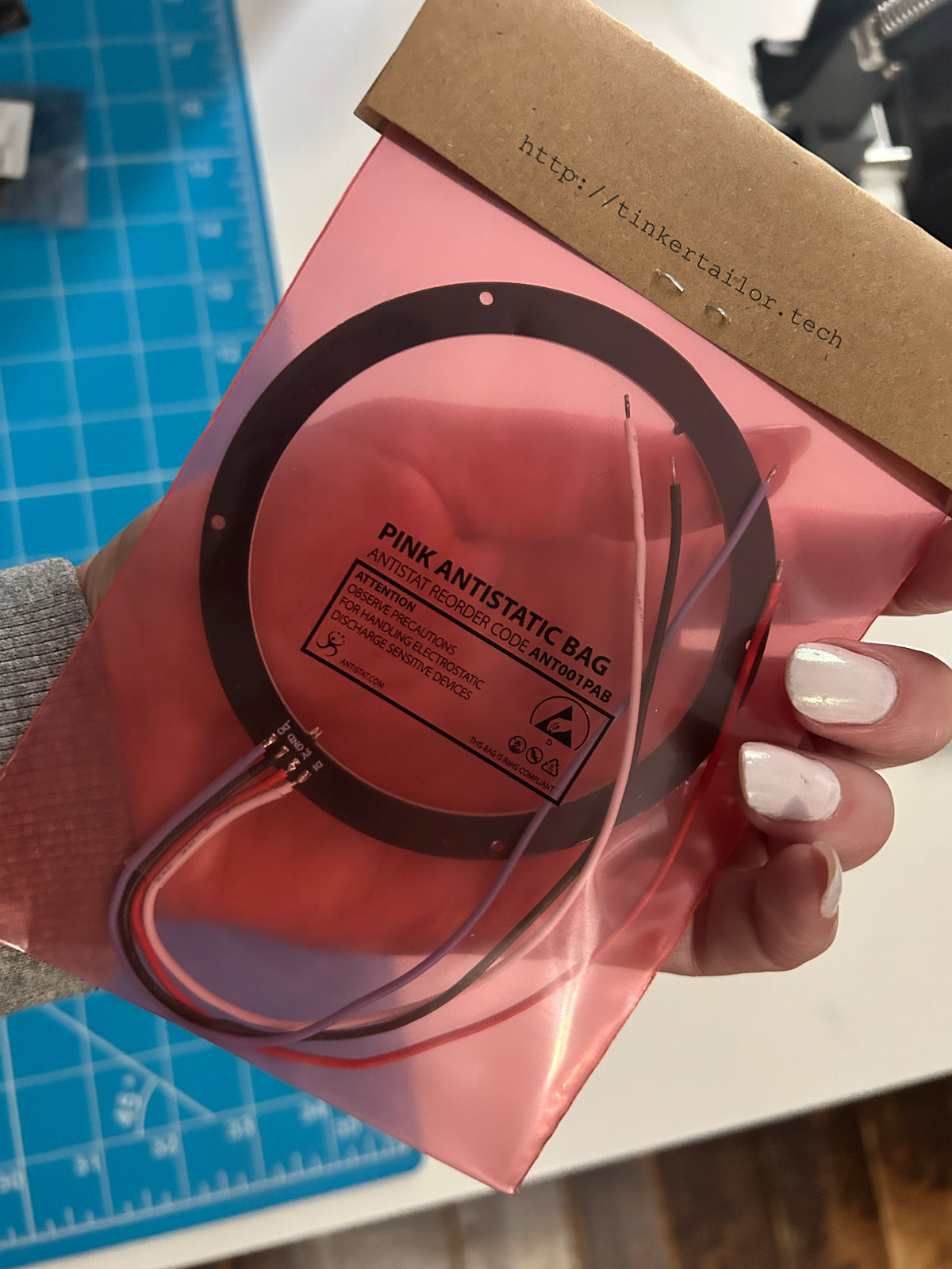 Hand holding a packaged 24-LED WS2812B ring