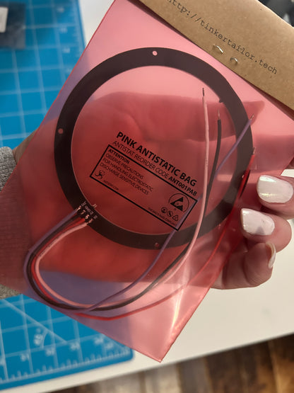 Packaged 24-LED WS2812B ring held up in a pink bag